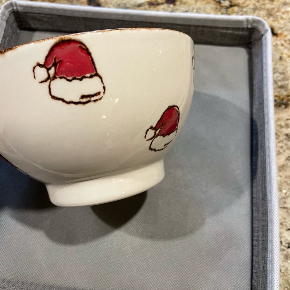 Three Beautiful Santa hat cereal bowls made in Portugal. The main color is bone.